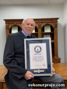 Realtor Ben Caballero with Guinness Record plaque